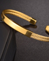 Bold Industrial Torque Cable Cuff Bracelet - Polished Gold-Tone Twisted Steel Style
